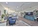 Open living space connecting the kitchen and sitting area, creating an inviting atmosphere at 4811 Sandy Glen Way, Wimauma, FL 33598