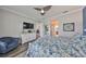 Comfortable main bedroom with ceiling fan and bright natural light at 4811 Sandy Glen Way, Wimauma, FL 33598