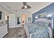 Main bedroom features ensuite bath, walk in closet and ceiling fan at 4811 Sandy Glen Way, Wimauma, FL 33598