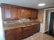Traditional-style kitchen featuring granite counters, stainless steel appliances, and ample cabinetry at 5130 Tilson Dr, New Port Richey, FL 34652