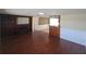 Open-concept living room boasts hardwood floors, a fireplace, and a seamless flow to the kitchen at 5130 Tilson Dr, New Port Richey, FL 34652
