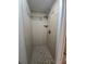 Tiled shower with built-in shelves and neutral-toned accents at 5130 Tilson Dr, New Port Richey, FL 34652