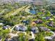 Breathtaking aerial view overlooking the community, featuring meticulously maintained lawns, homes, and nearby golf course at 5454 Saddlebrook Way # 2, Wesley Chapel, FL 33543