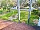 A well-manicured front yard and charming driveway offer a welcoming approach to this lovely home at 5454 Saddlebrook Way # 2, Wesley Chapel, FL 33543
