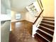 Bright living room with stairs, and hardwood-style floors at 5454 Saddlebrook Way # 2, Wesley Chapel, FL 33543
