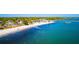 Breathtaking aerial view of waterfront property with sandy beach and pier at 6075 Shore S Blvd # 509, Gulfport, FL 33707
