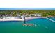Scenic aerial view of a waterfront community and pier along the ocean at 6075 Shore S Blvd # 509, Gulfport, FL 33707