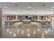 Huge ballroom featuring neutral colors, hard flooring, ample lighting, and many tables and chairs at 6075 Shore S Blvd # 509, Gulfport, FL 33707