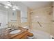 Full bathroom with granite vanity, tile tub surround and updated fixtures at 6075 Shore S Blvd # 509, Gulfport, FL 33707