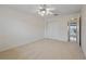 Neutral carpeted bedroom with ceiling fan with a double door closet awaits you at 6075 Shore S Blvd # 509, Gulfport, FL 33707