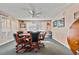 Cozy game room features a round table with chairs, bright window lighting and vintage decor at 6075 Shore S Blvd # 509, Gulfport, FL 33707