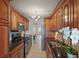 Well-equipped kitchen with stainless steel appliances, granite countertops, and wood cabinets at 6075 Shore S Blvd # 509, Gulfport, FL 33707