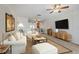 Bright living room with modern furnishings and a large TV for comfortable viewing at 6075 Shore S Blvd # 509, Gulfport, FL 33707