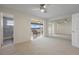 Spacious, carpeted main bedroom with adjoining sunroom, bathroom and mirrored closet at 6075 Shore S Blvd # 509, Gulfport, FL 33707