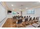 Classy meeting room with ample seating, white board, flat screen TV and custom lighting at 6075 Shore S Blvd # 509, Gulfport, FL 33707