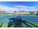 Outdoor tennis court for recreational and competitive play with blue and green court colors at 6075 Shore S Blvd # 509, Gulfport, FL 33707