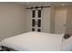 Cozy bedroom with modern barn door, offering a peaceful retreat within the home at 6225 Imperial Ky, Tampa, FL 33615