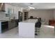 Bright kitchen featuring sleek cabinetry, stainless steel appliances, and a spacious kitchen island at 6225 Imperial Ky, Tampa, FL 33615