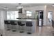 Modern kitchen featuring sleek cabinetry, stainless steel appliances, and a stylish kitchen island at 6225 Imperial Ky, Tampa, FL 33615