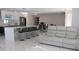 Open-concept kitchen with island, modern appliances, seamlessly connected to the living area at 6225 Imperial Ky, Tampa, FL 33615