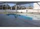 Backyard featuring a pool with screened enclosure offering a serene outdoor living space at 6225 Imperial Ky, Tampa, FL 33615