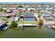 Drone shot of a waterfront home with a pool and dock with direct canal access at 6511 Senegal Palm Way, Apollo Beach, FL 33572