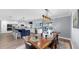 Open concept kitchen features a large island, modern appliances, and a dining area at 6511 Senegal Palm Way, Apollo Beach, FL 33572