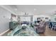 Inviting living room with a blend of coastal decor, comfortable seating, and abundant natural light at 6511 Senegal Palm Way, Apollo Beach, FL 33572