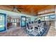 Outdoor dining area with bar, barbecue, and view to the kitchen and dining room at 6511 Senegal Palm Way, Apollo Beach, FL 33572