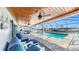Spacious patio with clear views of the pool, canal, and outdoor seating at 6511 Senegal Palm Way, Apollo Beach, FL 33572