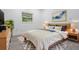Cozy bedroom with neutral decor and wood-look flooring at 7249 Berry Rd, Zephyrhills, FL 33540