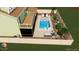 Aerial view of custom pool design featuring patio area, screened porch, and backyard landscaping at 7591 Harbor View Way, Seminole, FL 33776