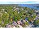Beautiful aerial view highlighting a home with a pool and stunning waterfront views at 7591 Harbor View Way, Seminole, FL 33776