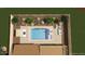 Overhead shot of a custom pool and patio area with landscaping and outdoor seating space at 7591 Harbor View Way, Seminole, FL 33776