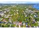 High angle view of a neighborhood with large trees and greenery throughout at 7591 Harbor View Way, Seminole, FL 33776