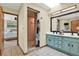 Bathroom featuring dual sink vanity and separate tiled shower in a stylish layout at 7591 Harbor View Way, Seminole, FL 33776