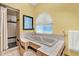 Bathroom featuring tub with tile surround, a shower with tiled walls, and a window with blinds at 7591 Harbor View Way, Seminole, FL 33776