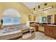 Primary bathroom suite features a tub and dual sink vanity at 7591 Harbor View Way, Seminole, FL 33776