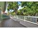 Spacious wooden deck with natural green tree views at 7591 Harbor View Way, Seminole, FL 33776