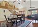Inviting living area with hardwood floors, vaulted ceiling, large windows, and comfortable seating at 7591 Harbor View Way, Seminole, FL 33776