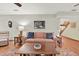 Comfortable living room with hardwood floors and staircase at 7591 Harbor View Way, Seminole, FL 33776