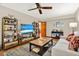 Inviting living room with hardwood floors, TV, and decor at 7591 Harbor View Way, Seminole, FL 33776