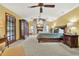 Spacious bedroom boasts vaulted ceilings, brick fireplace, and natural light at 7591 Harbor View Way, Seminole, FL 33776