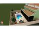 Backyard pool rendering featuring a sun shelf, patio furniture, and lush landscaping at 7591 Harbor View Way, Seminole, FL 33776