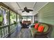 Large screened-in porch offers comfortable seating and serene outdoor views at 7591 Harbor View Way, Seminole, FL 33776