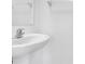Bathroom features a white sink with silver faucet and towel rack, perfect for modern living at 8299 Crescent Oaks Dr, New Port Richey, FL 34655