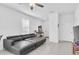 Spacious living room with tile flooring and a gray sofa at 8299 Crescent Oaks Dr, New Port Richey, FL 34655
