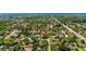 An aerial view of a residential neighborhood, showcasing the home's location near a body of water at 838 Park Ct, Palm Harbor, FL 34683