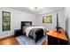 Bedroom with a cozy bed, gray color scheme, and large window at 838 Park Ct, Palm Harbor, FL 34683