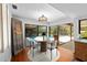 Inviting dining area with view of the pool and access to the outside, featuring a light-toned round table at 838 Park Ct, Palm Harbor, FL 34683